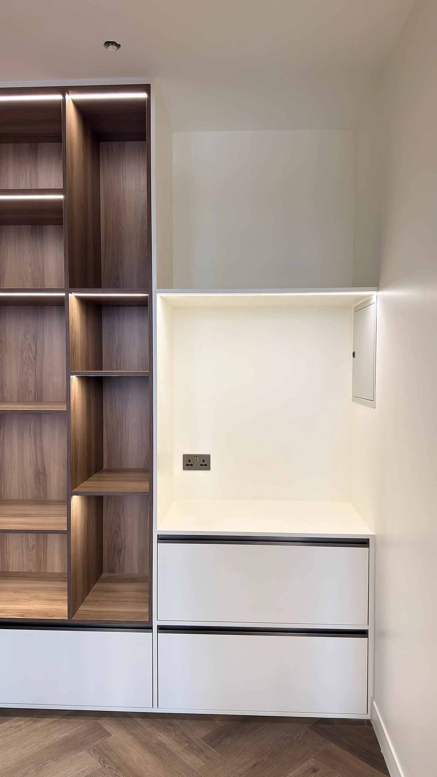 Walnut display unit with open shelving and drawer bank in Dubai