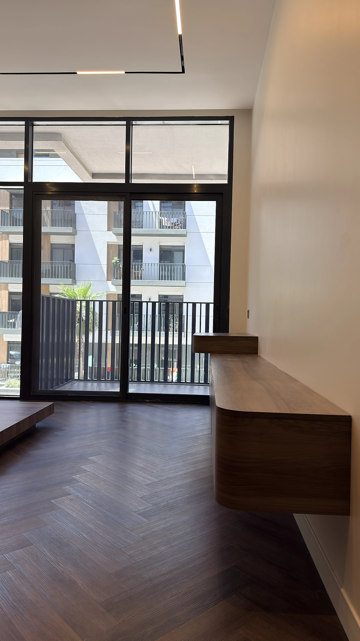 Living room fit-out with window bench and herringbone floor, Dubai