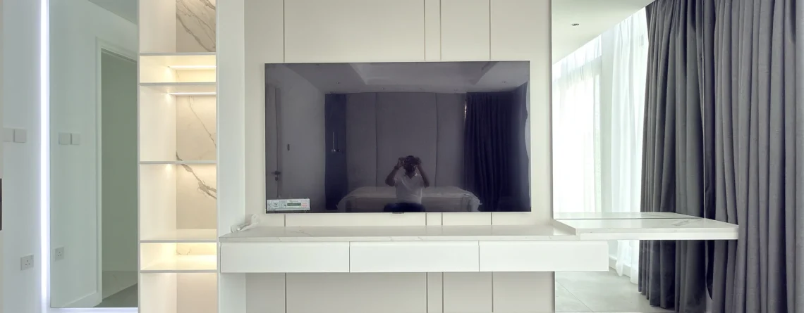 Bespoke TV unit and media wall in Dubai with LED-lit shelving and floating console
