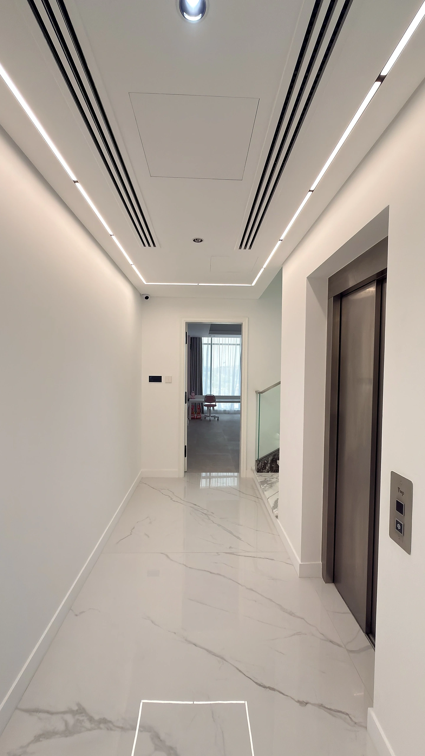 Villa corridor with white PU panelled doors and marble floor, Dubai